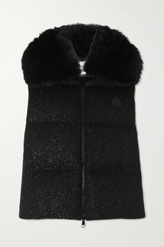 Moncler's 'Carrelet' gilet is made from wool-blend tweed that's woven with metallic yarns to create a subtle sparkle. Framed by a fluffy faux fur collar, it's filled with insulating down and has a breathable léger lining. The brand's logo patch is appliqued on the chest in tonal black and it has handy zipped pockets on either side. Upper East Side Fashion, Black Fur Vest, Snow Wear, Knitted Swimsuit, Moncler Women, Bodysuit Blouse, Metallic Yarn, Black Faux Fur, Down Vest