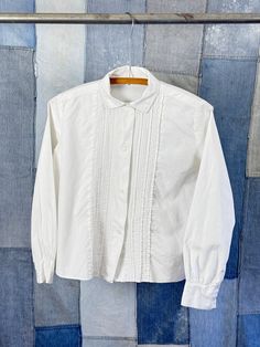 "An authentic vintage womens long sleeve shirt blouse with pleated detail  era : 1950s 60s material : cotton color : white condition : great, appropriate signs of age and wear as seen in photos size : xsmall to small , please compare measurements below actual garment measurements : chest : 39\" shoulder : 14\" sleeve : 21\" length : 21\" - - - - - - - - - - - - - - - - - - - - - - - - - - - - - - - - - - - - - - - -  INTERNATIONAL SHIPPING AVAILABLE UPON REQUEST Craft Union does NOT accept returns or exchanges, all items are FINAL SALE Please consider the following prior to placing an order : Because measurements are provided, Craft Union does NOT grant refund/exchange requests if an item does not fit. We are always happy to assist interest buyers with any size/fit concerns using the \"ask Pleated Shirt, Womens Long Sleeve Shirts, Vintage 1950s, Womens Clothing Tops, White Cotton, Long Sleeve Shirt, Women Long Sleeve, Vintage Ladies, Sleeve Shirt