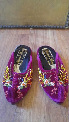 So cute!! Asian / Vietnamese children's slipper traditional shoes. Bright magenta velvet with traditional bead work on the front. Curled front of shoe. Beads on back of heel. In new condition apart from sticker part of right inside shoe coming up. There is no size label Length inside 6 inches, across toe 3 inches Traditional Handmade Slippers With Round Toe, Traditional Closed Toe Mules For Festivals, Traditional Closed Toe Mules For Festive Occasions, Traditional Embroidered Round Toe Slippers, Traditional Embroidered Slip-on Slippers, Traditional Embroidered Closed Toe Mules, Magenta Velvet, Traditional Shoes, 90s Velvet