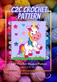 the crochet unicorn pattern is shown in front of many balls of knitting yarn