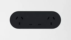 an electrical outlet with two black outlets