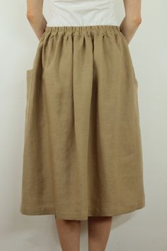 "Write the selected color in the message Handmade nut brown linen long skirt with pockets , perfect for casual wear and suitable for any occasion in any season Details: - 100% natural linen produced in Europe ; - medium weight (180 gram per square meter); - color: could be any from our colors catalog (color samples at the photo); Made to order, approximately a few days, If you have any questions please message me and I will be glad to answer. Size guide : Size XS Bust: fits bust around 33\"-34\" Chic Beige Linen Maxi Skirt, Brown Gathered Maxi Skirt For Summer, Brown Flowy Maxi Skirt With Pockets, Neutral Linen Summer Skirt, Beige Linen Pleated Skirt, Beige Pleated Linen Skirt, Beige Linen Gathered Skirt, Brown Linen Long Skirt, Beige Relaxed Linen Maxi Skirt