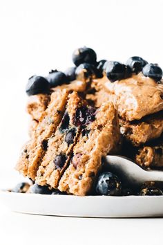 a white plate topped with blueberry oatmeal bars