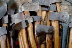 many different types of hammers are stacked on top of each other