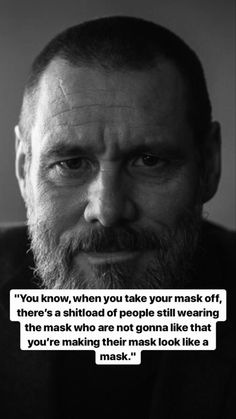 a man with a beard is looking at the camera and has a quote on it