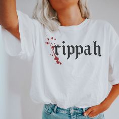 a woman wearing a white shirt with the word rippah painted on it's chest