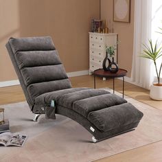 a reclining chair sitting on top of a rug in a living room