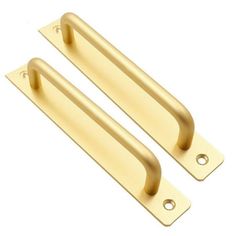 two brass door handles on white background