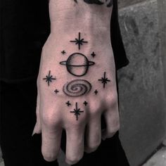 a person with a tattoo on their hand