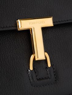 A sophisticated messenger bag like TOM FORD's brings so much to an outfit. Suspended from a sleek shoulder strap, it's made from supple textured-leather and has a boxy shape with plenty of room for your wallet, sunglasses and cologne. The gold-tone 'T' clasp makes a great focal point. Luxury Tan Crossbody Shoulder Bag, Timeless Formal Briefcase With Gold-tone Hardware, Timeless Evening Briefcase With Palladium Hardware, Timeless Briefcase With Gold-tone Hardware, Modern Tan Bags For Everyday Luxury, Timeless Tan Shoulder Bag For Office, Elegant Tan Shoulder Bag With Leather Lining, Designer Tan Shoulder Bag For Office, Luxury Evening Crossbody Briefcase