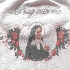 an embroidered t - shirt with the words pray with me and a photo of mary