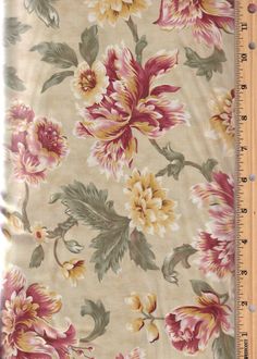 a ruler is next to a flowered fabric