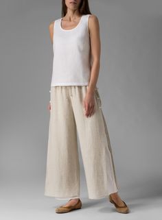 Chic Linen Loungewear Bottoms, Chic Linen Bottoms For Loungewear, Elegant Wide-leg Sweatpants For Loungewear, Relaxed Beige Wide-leg Pants, Elegant Wide Leg Loungewear Pants With Pockets, Elegant Wide Leg Lounge Pants With Pockets, Elegant Summer Loungewear Pants, Comfortable Beige Wide-leg Pants, Chic Tapered Leg Loungewear Pants