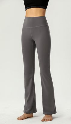 The EMES SHOP pants are detailed with a high rise waist. wide waistband. and are fitted down the thigh and flare at the ankle. Features back body contouring seams. These breathable. buttery soft. lightweight. sweat-wicking stretchy yoga pant leggings are perfect for a quick workout. or to throw on when spending the morning out doing errands. Finish off the look with a crewneck and sneakers for a polished athletic look. MATERIAL: 75% Nylon. 25% Spandex MEASUREMENTS: X-Small : 0-... Mid-rise High Stretch Solid Yoga Pants, Solid Mid-rise High Stretch Yoga Pants, Solid Color Mid-rise High Stretch Yoga Pants, High Stretch Gray Elastane Pants, Gray High Stretch Elastane Pants, Fitted Wide Leg Yoga Pants With Comfort Waistband, Gray High Stretch Elastane Yoga Pants, Compressive Full-length Solid Yoga Pants, Stretch Full-length Yoga Pants With Contoured Waistband