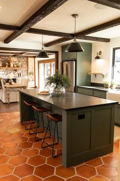 a large kitchen with an island in the middle