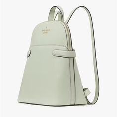 Nwt! Kate Spade Staci Dome Backpack Color: Light Olive Measurements 10.2" W X 11.2" H X 5.52" D Features Metal Pinmount Logo Closure Type: Zip Closure Dust Bag Included: No Exterior: Front Slip Pocket Materials Saffiano Leather Lining: Two Way Spade Jacquard Lining Imported Style Number K7340 Brand New Still In Kate Spade Packaging Please See All Photos As They Are Part Of The Description. Please Ask Any Questions Before Bidding Or Buying. No Cancellations Or Returns. All Sales Are Final. Luxury Kate Spade Backpack For On-the-go, Kate Spade Staci, Light Backpack, Olive Color, Color Light, Green And Gold, Kate Spade, Dust Bag, Bag Lady