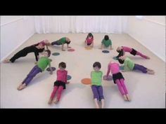 a group of children doing yoga in a circle