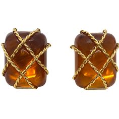 Seaman Schepps 18k gold earrings with amber from Cage collection DESIGNER: Seaman Schepps MATERIAL: 18K Gold GEMSTONE: Amber DIMENSIONS: earrings are 26mm x 20mm WEIGHT: 21.9g MARKED/TESTED: Seaman Schepps,makers mark,750,1029 CONDITION: Estate Luxury Amber Gold Plated Jewelry, Luxury Amber Gold-plated Jewelry, Luxury Amber Intaglio Jewelry, Modern Brown Earrings For Formal Occasions, Orange Clip-on Earrings For Formal Occasions, Formal Orange Clip-on Earrings, Modern Gold Cabochon Earrings, Orange Pierced Earrings For Formal Occasions, Formal Orange Pierced Earrings