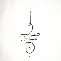 a black and white photo of a hanging ornament with swirls on it