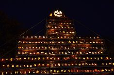 a large tower with lots of lit up letters on it