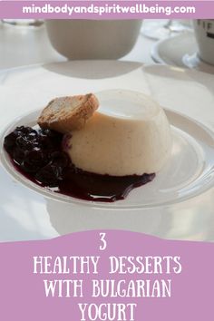 three healthy desserts with blueberry yogurt on a white plate in front of coffee cups and saucers