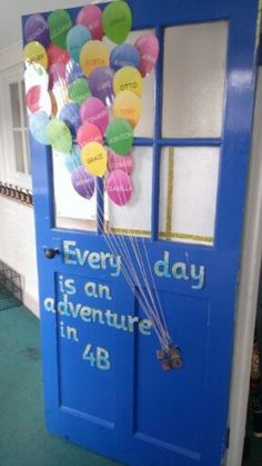 a door decorated with balloons and the words every day is an adventure in 4b