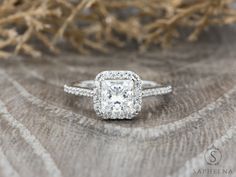 an engagement ring with a princess cut diamond in the center