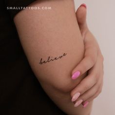 a woman's arm with the word believe tattooed on it