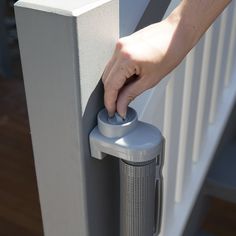 a person is pressing the button on a door handle