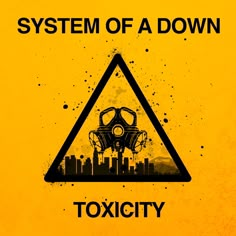 a yellow sign that says system of a down with a gas mask in the middle