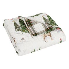 a blanket with christmas trees and deers on it