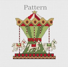 a cross stitch pattern with a merry go round ride and horses on it's side