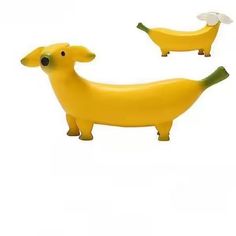 two plastic banana shaped animals on a white background