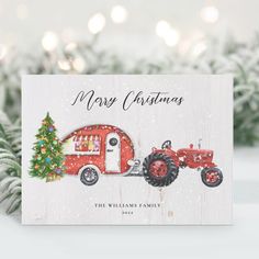 a christmas card with an old red tractor