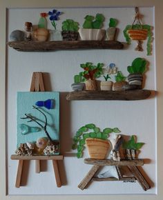 two wooden shelves filled with plants on top of a white wall next to a painting