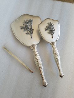 "Featuring this rare Silver Color Matson 3-Piece piece Vanity Set that features Dogwood flowers and Matson's iconic Bird. It is Silver on Silver which in my 20 years of thrift hunting have I come across Silver ones. It came from a huge Estate Sale in Fort Collins, Co. The mirror does have some metal discoloration at the bottom please look at the photos nothing too bad. Makes a nice Wedding or Christmas Gift. The mirror is in excellent condition and brush is nice and clean. It will arrive careful Pretty Vanity, Silver Vanity Set, Silver Vanity, Hand Mirrors, Bathroom Vanity Decor, Vanity Sets, House Dream, Simply Shabby Chic, Dogwood Flowers