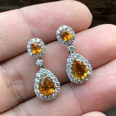 ENJOY OUR WORRY-FREE SERVICE AND THE DAZZLING, GENUINE JEWELRY WE DESIGN AND HANDCRAFT WITH LOVE❤️ ABOUT THE ITEM: CERTIFIED 4.22 Total Carats, Thai yellow sapphires and 1.02 carats of E/VVS, natural diamonds, set in handmade 8.5 grams, 18K solid gold, CHIC dangling earrings. ONE OF A KIND HANDCRAFTED EARRINGS. WE OFFER FREE CHRISTMAS GIFT PACKAGING, CHRISTMAS CARD WITH PERSONAL NOTES, FREE RING SIZING AND FREE-OF-CHARGE 14-DAY RETURN! FREE 2 Days UPS EXPRESS SHIPPING! Grab now before too late I Gia Certified Yellow Gold Teardrop Jewelry, Dazzling Drop Diamond Earrings As Gift, Pear-shaped Diamond Earrings With Gemstones As A Gift, Pear-shaped Diamond Earrings With Gemstone For Gift, Gia Certified Dangle Diamond Earrings As Gift, Hallmarked Pear-shaped Diamond Earrings As Gift, Hallmarked Pear-shaped Diamond Earrings For Gift, Gift Pear-shaped Hallmarked Diamond Earrings, Gold Chic