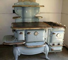 an old fashioned stove is sitting in the corner