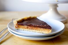 a piece of chocolate pie on a plate with a fork