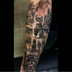 a man's arm with an animal tattoo on it, and the image of two wolf