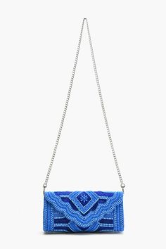 Handmade Flap Clutch All-Over Embellished Beaded Work Made of Cotton Detachable Chain Strap Magnetic Button Closure Inside Zip Pocket Size : 10" x 4.5" x 3" Sparkle and shine with the Cobalt Blue Glamour Clutch—because your outfit deserves a pop of blue!TThis 10 x 4.5 x 3 beauty is packed with all-over beaded embellishments that scream ‘fabulous’. Handmade with love and made from 100% cotton, it’s perfect for adding a splash of glamour to any outfit. Featuring a detachable chain strap for hands-free fun, a magnetic button closure to keep your essentials safe, and an inside zip pocket for your must-haves. Shine bright, clutch tight!