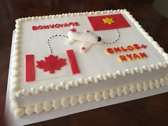 a birthday cake decorated with an airplane and flag