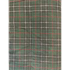 a green and white plaid skirt with red accents