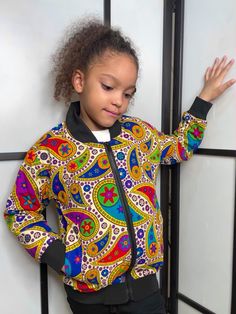 Check out these adorable bomber jackets for kids.  Beautifully designed with African Kente print, these bomber jackets for children are perfect for colder weather as they are well-insulated.  Buy now before they sell out!  If your child's size is not available now, the added bonus is that these jackets can be ordered so that they are custom made to fit your child perfectly.  We can make any size including plus size.  Purchase as displayed or change the  design! The choice is yours! Style: Casual Colour: Multi-coloured Unisex Pattern Type: All over print / African Kente print / geometric / graphic Length: Regular Season: All Type: Bomber jacket Details: Fully lined / pockets / zipper Fit Type: Regular / true to size fit Size: Any size including plus size can be custom made Neckline: Basebal Multicolor Cartoon Print Outerwear For Fall, Multicolor Cartoon Print Outerwear With Long Sleeves, Multicolor Cartoon Print Long Sleeve Outerwear, Multicolor Long Sleeve Outerwear With Cartoon Print, Fall Multicolor Outerwear With Cartoon Print, Fall Multicolor Cartoon Print Outerwear, Playful Long Sleeve Streetwear Outerwear, Kente Print, Dashiki Dress