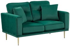 a green couch with pillows on it and some gold trimmings around the arms