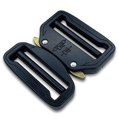 two black plastic buckles with gold accents on each side and one has a metal clip in the middle