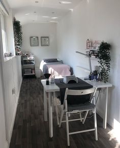 a room with white walls and wooden floors