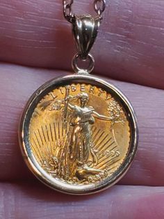 Gold coin 1/10 ounce Liberty, American Eagle 24k on a 14k gold pendant,no chain. Yrs. 1997, 2004, 2007 Canada maple leaf 1999, 2001. I will make a chain any length you like. Engraved Yellow Gold Coin Necklace Collectible, Collectible Engraved Yellow Gold Coin Necklace, Hallmarked Yellow Gold Coin Necklace, Coin Necklace Gold, Gold Coin Pendant, Canada Maple Leaf, Gold Coin Necklace, Gold Coin, Pendant Gold