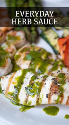 a white plate topped with grilled chicken covered in green sauce