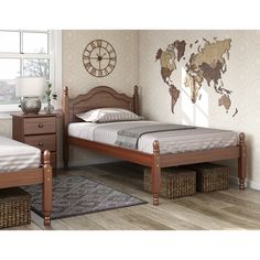 a bedroom with two twin beds and a world map on the wall behind them,